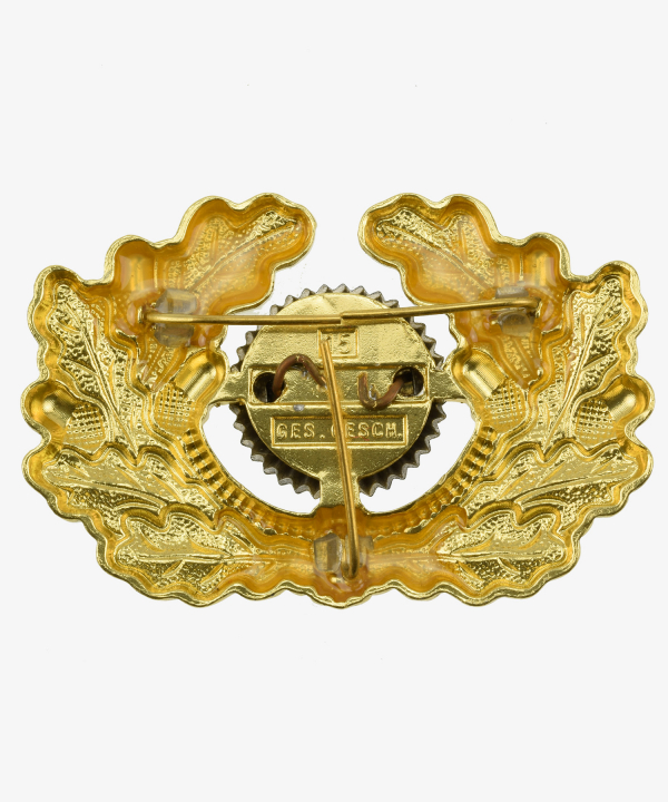 Wehrmacht Schirmmützeneichenlaub in Gold mit Kokarde